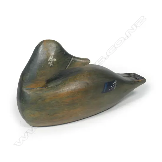 A hand carved 10" wooden duck decoy