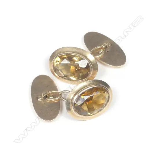 A pair of early 20thC 15ct. yellow gold and citrine cuff links