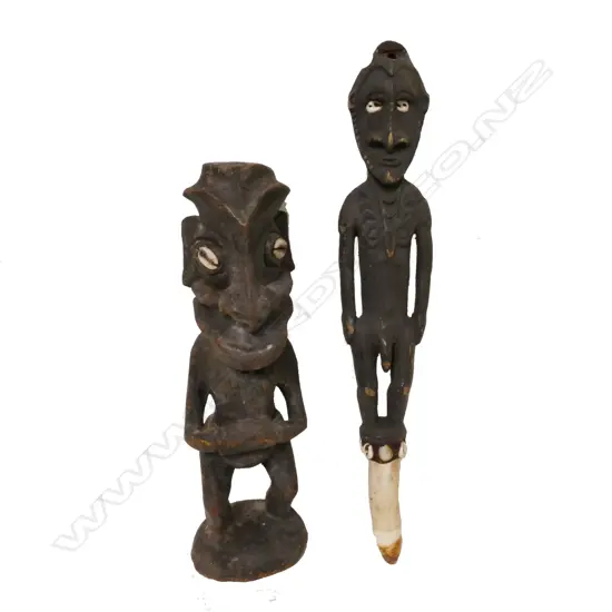 Two small carved PNG figures