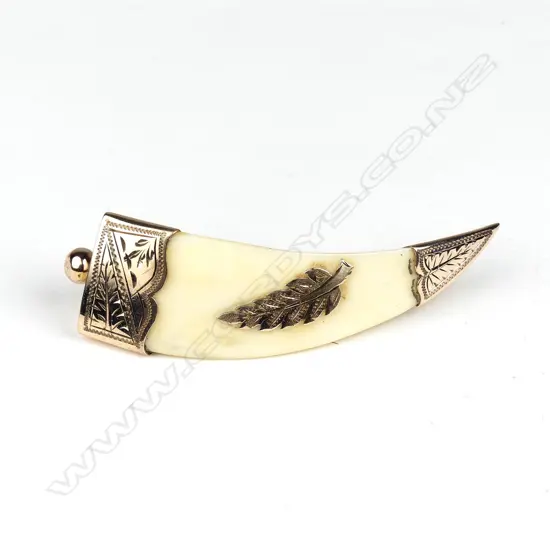 A colonial 9ct rose gold and tusk brooch