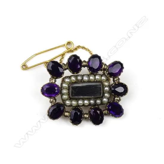 A Victorian silver gilt mourning brooch