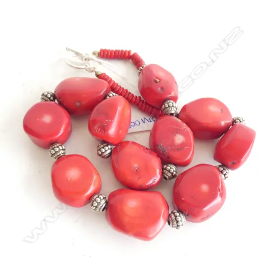 A dyed red coral and silver necklace