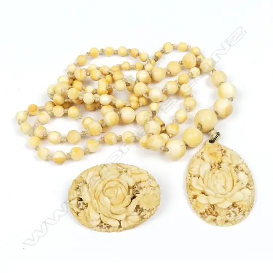 A vintage ivory bead necklace and pendant