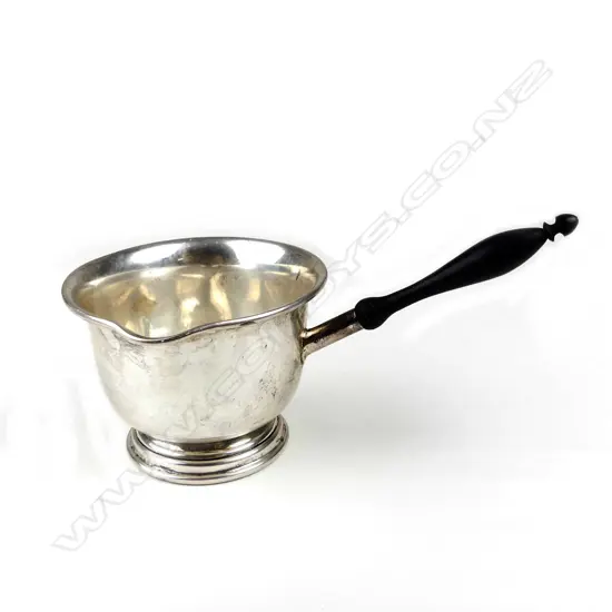A silver brandy pan