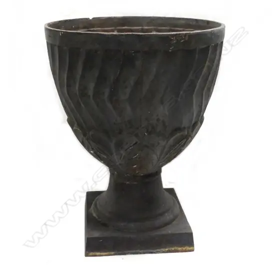 A vintage cast iron garden urn