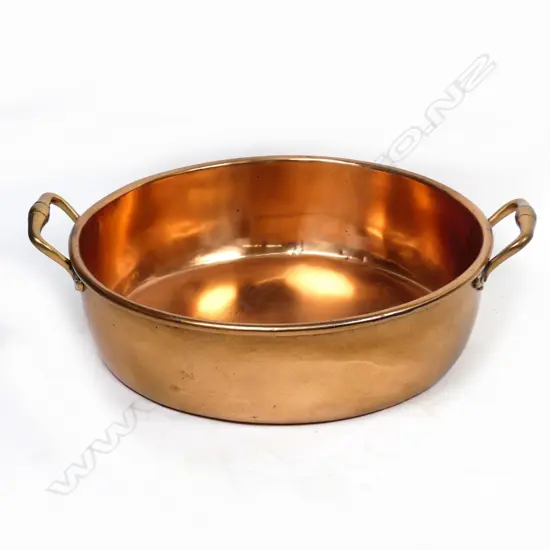 A large copper preserve or braising pan