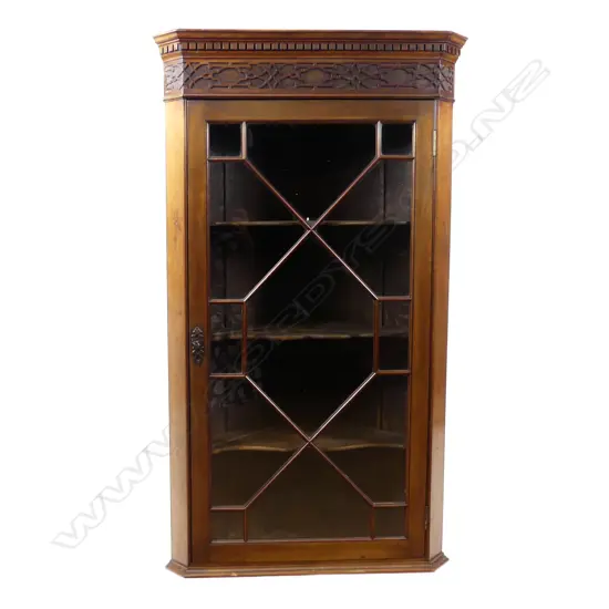 An old mahogany corner cabinet