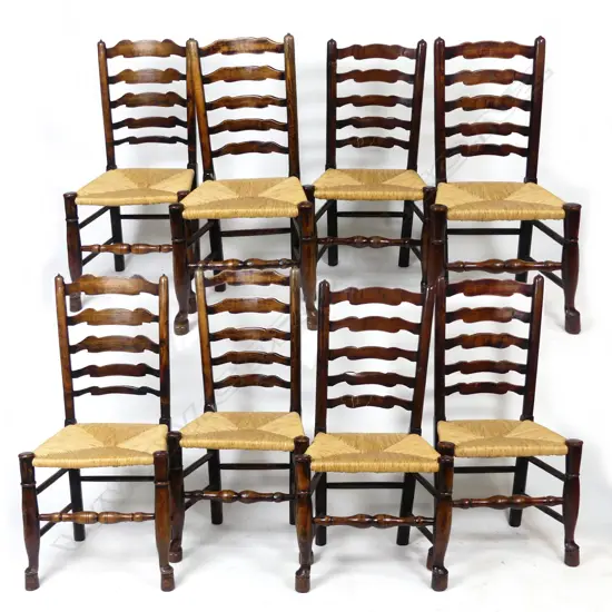 A set of eight oak ladder back chairs