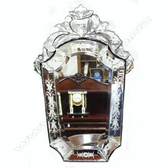A Venetian glass mirror