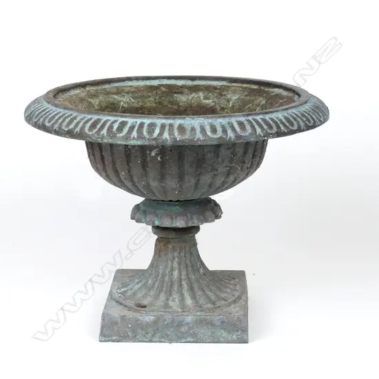 A small cast iron garden urn