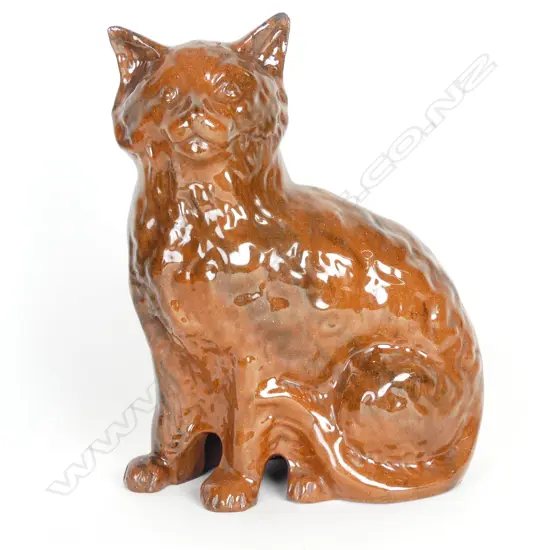 A vintage dark terracotta Staffordshire type cat