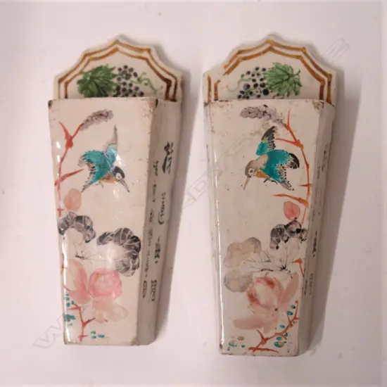 A pair of 19thC Chinese hand painted wall pockets