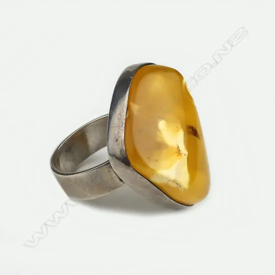An amber and silver ring
