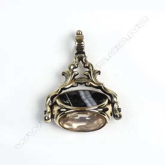 An early Victorian 9ct. yellow gold three-sided fob spinner