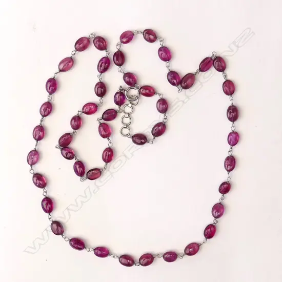 An 18ct white gold and pink sapphire bead necklace