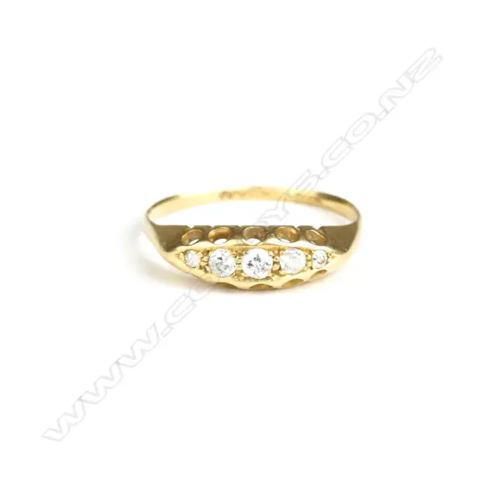 An estate 18ct. gold and diamond bridge ring