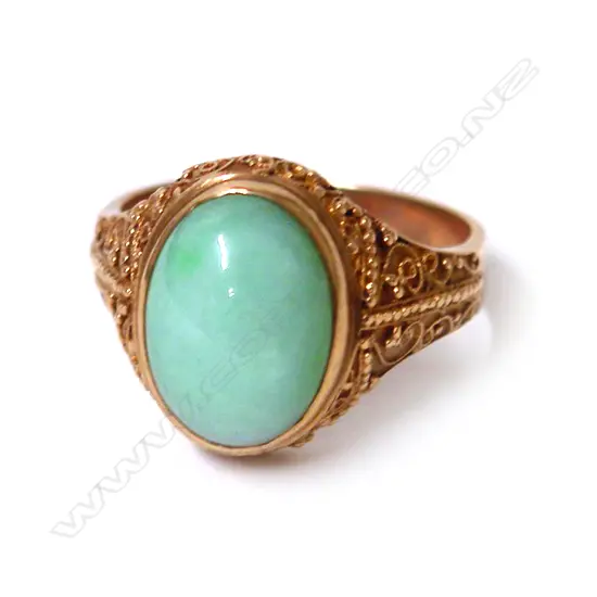 A 14ct. gold and jadeite dress ring