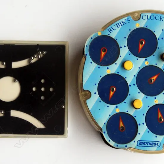 ‘Rubiks’ plastic clock type puzzle and a plastic contained metal ball puzzle