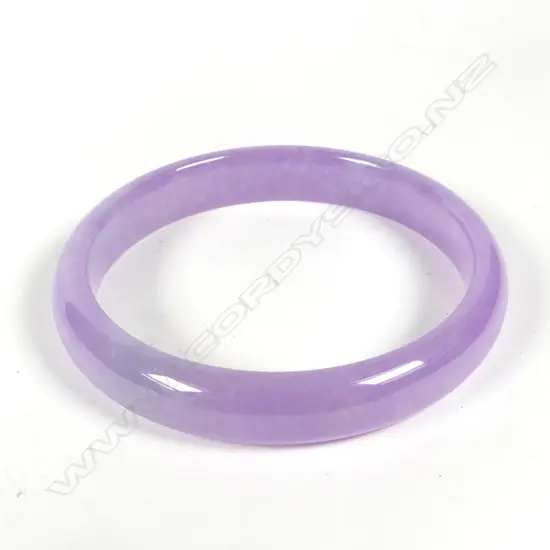 An uncommon mauve jade bangle