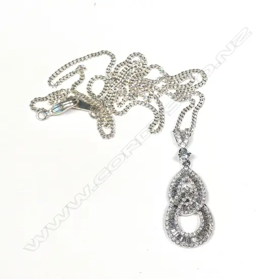 An 18ct white gold and diamond pendant