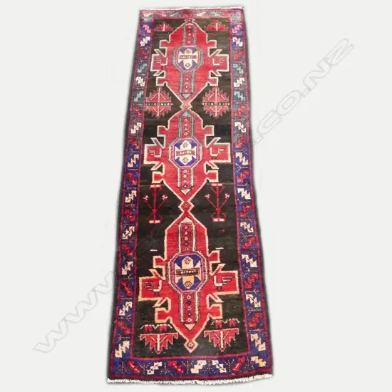 A Persian Heriz hand knotted runner