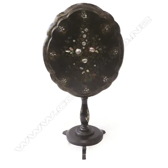 A Victorian papier-mâché tilt top table