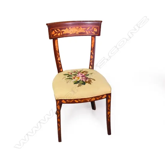 An inlaid bow back chair
