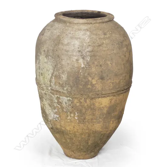 An old European terracotta tall storage jar