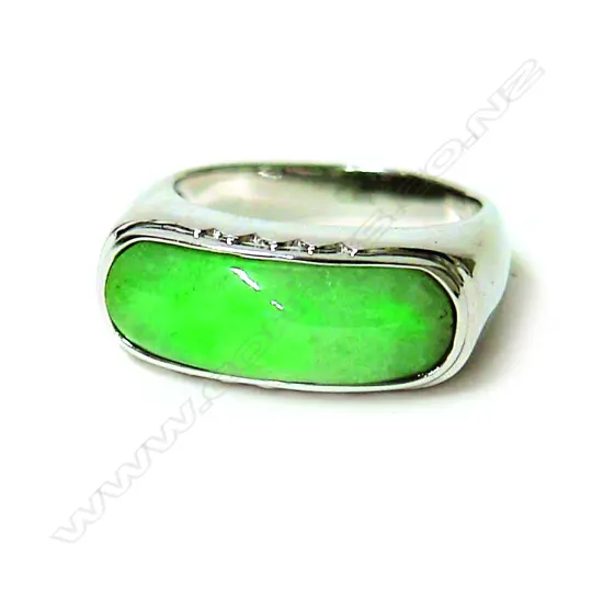 A modern 18ct. white gold and jadeite dress ring