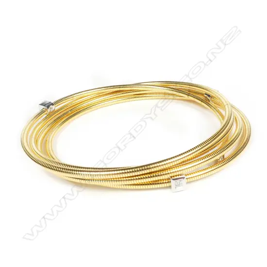 A modern 18ct. diamond set multi-loop bangle