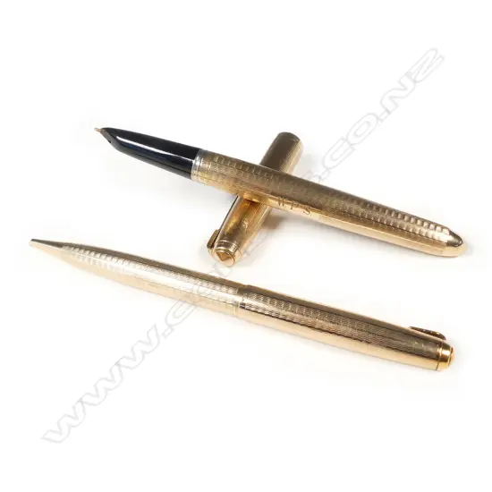 A pair of 9ct. yellow gold vintage Parker pens