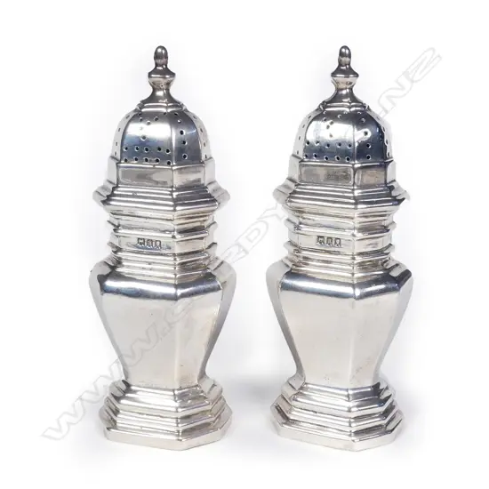 A pair of early 20thC George I style pepperettes