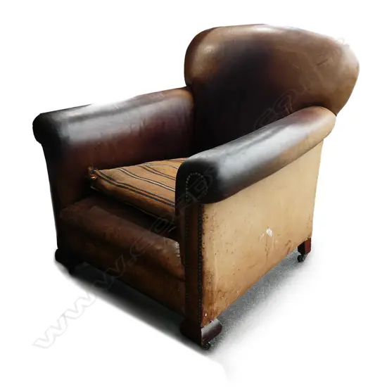 A vintage leather upholstered roll arm club-type chair