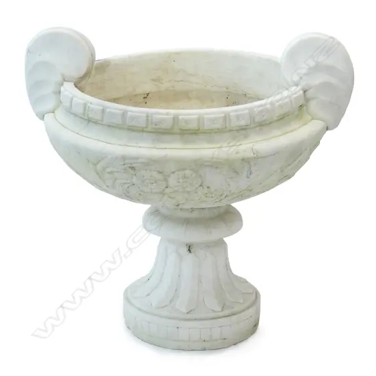 A white marble urn on stand