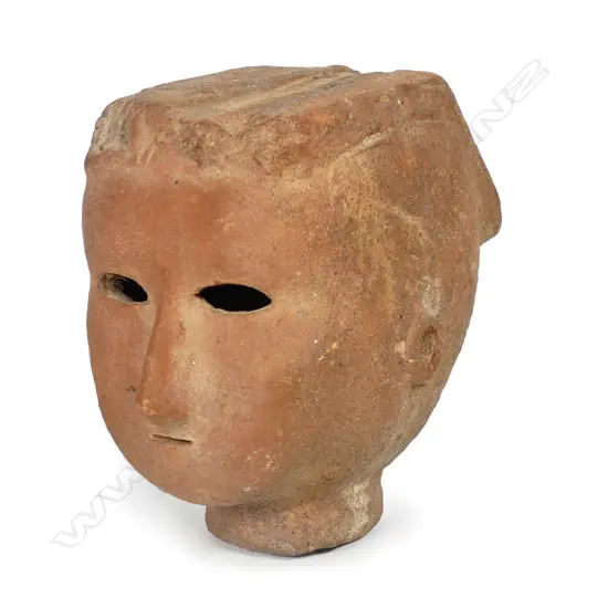 A Japanese Kofun period (5th - 6thC) Haniwa terracotta head of a female