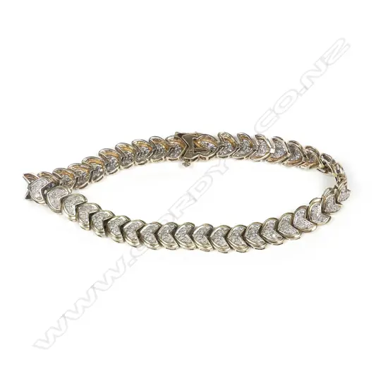A 9ct yellow gold and multi diamond bracelet