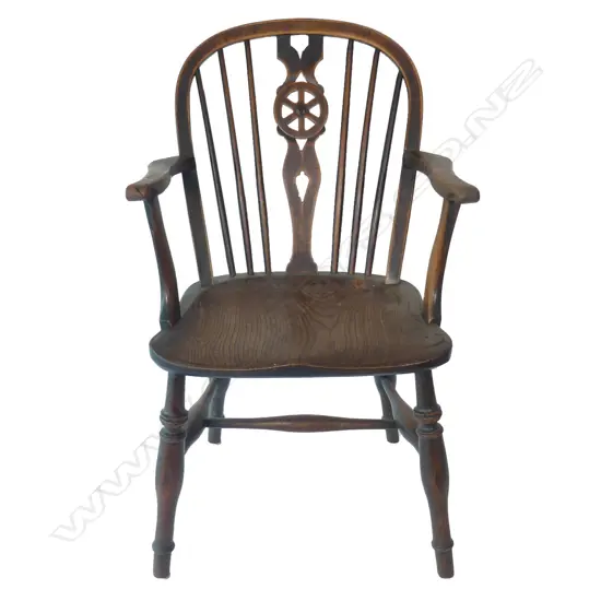 A 19thC country elm Windsor armchair