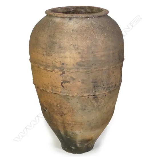 An old European terracotta tall olive oil storage jar