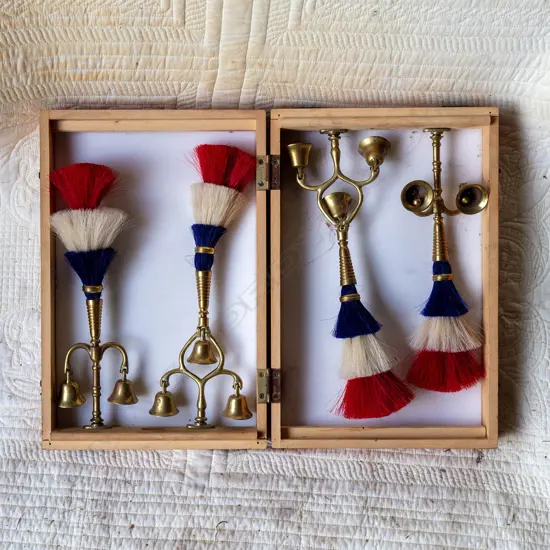 Four red, white and blue Lion Brewery tassels with bells,