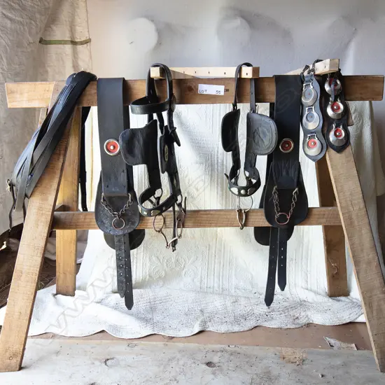 Two Back bands for plough plus two bridles - three medallion strips and two split reins