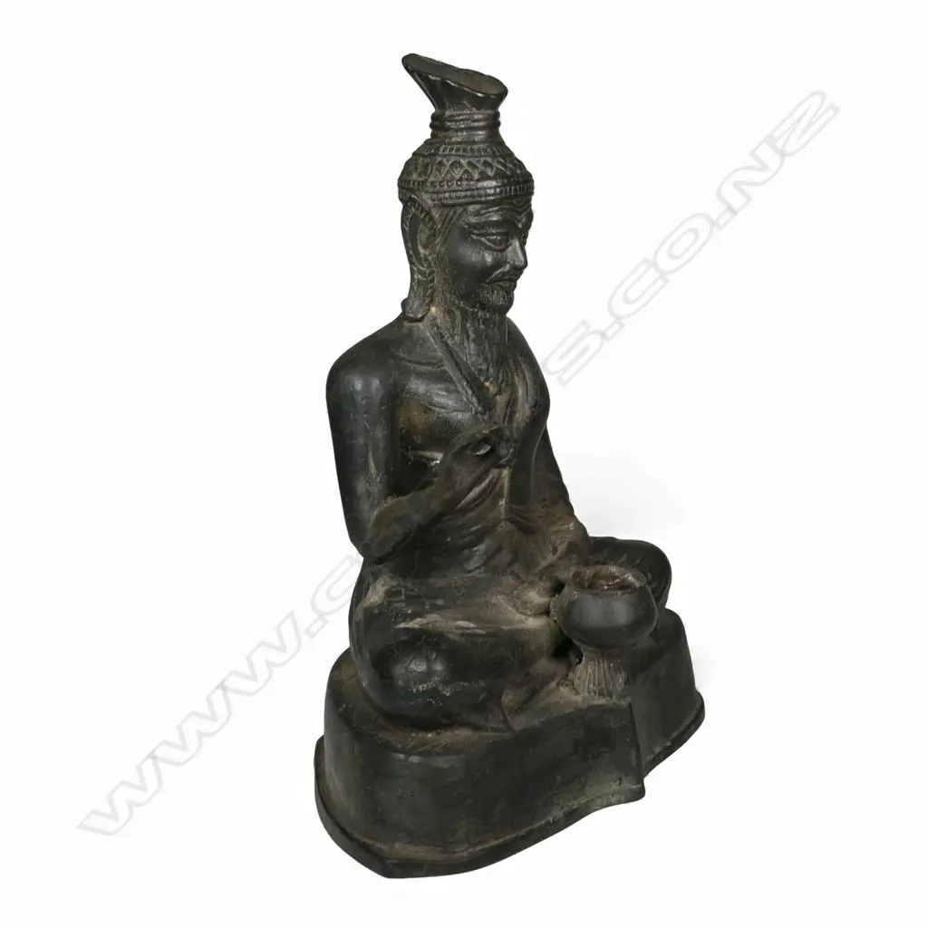 A Chinese bronze seated bearded immortal, Image 1++