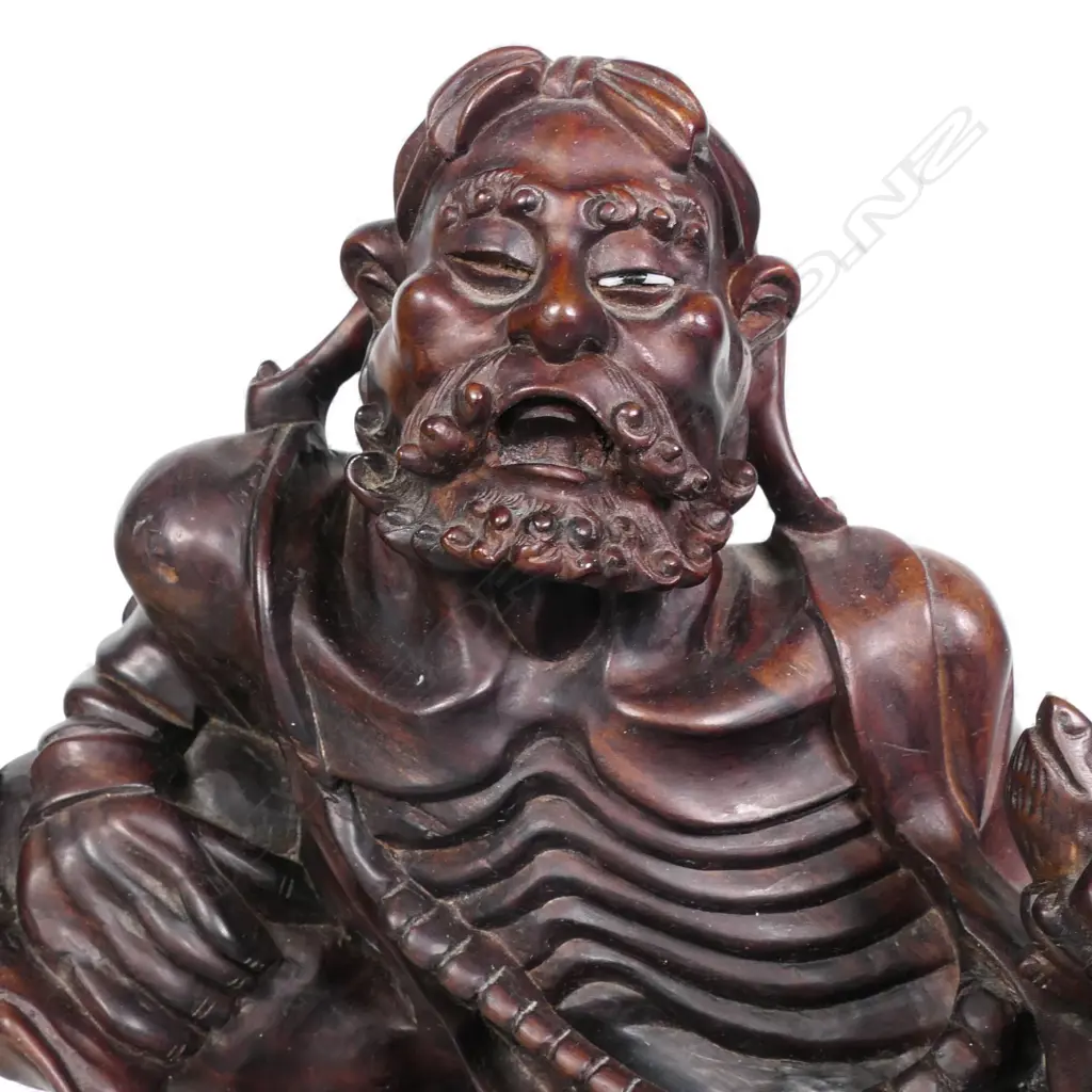 A carved Chinese hardwood reclining Immortal, Image 1++