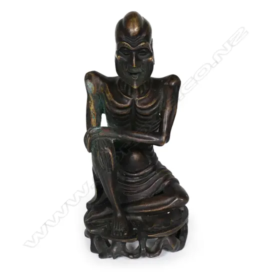 An early 1900s bronze figure of an emaciated Lohan,