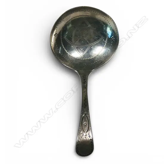 A George III silver finely engraved caddy spoon,