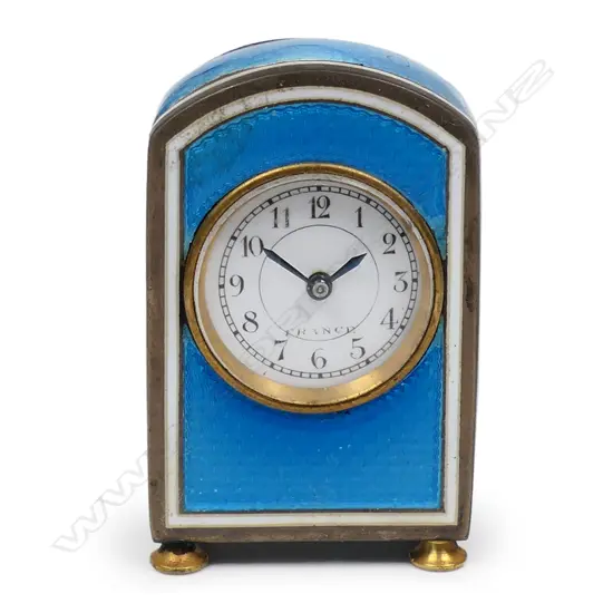 An early 20thC French silver and enamel miniature travelling clock,