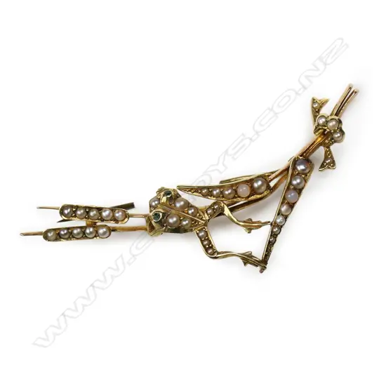 An Edwardian gold and seed pearl frog on reeds brooch,