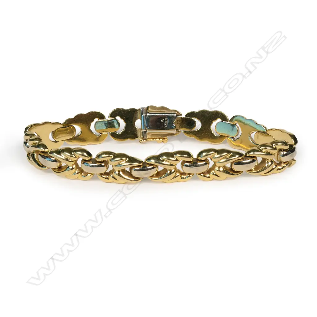 An 18ct two tone yellow and white gold designer link bracelet, Image 1++