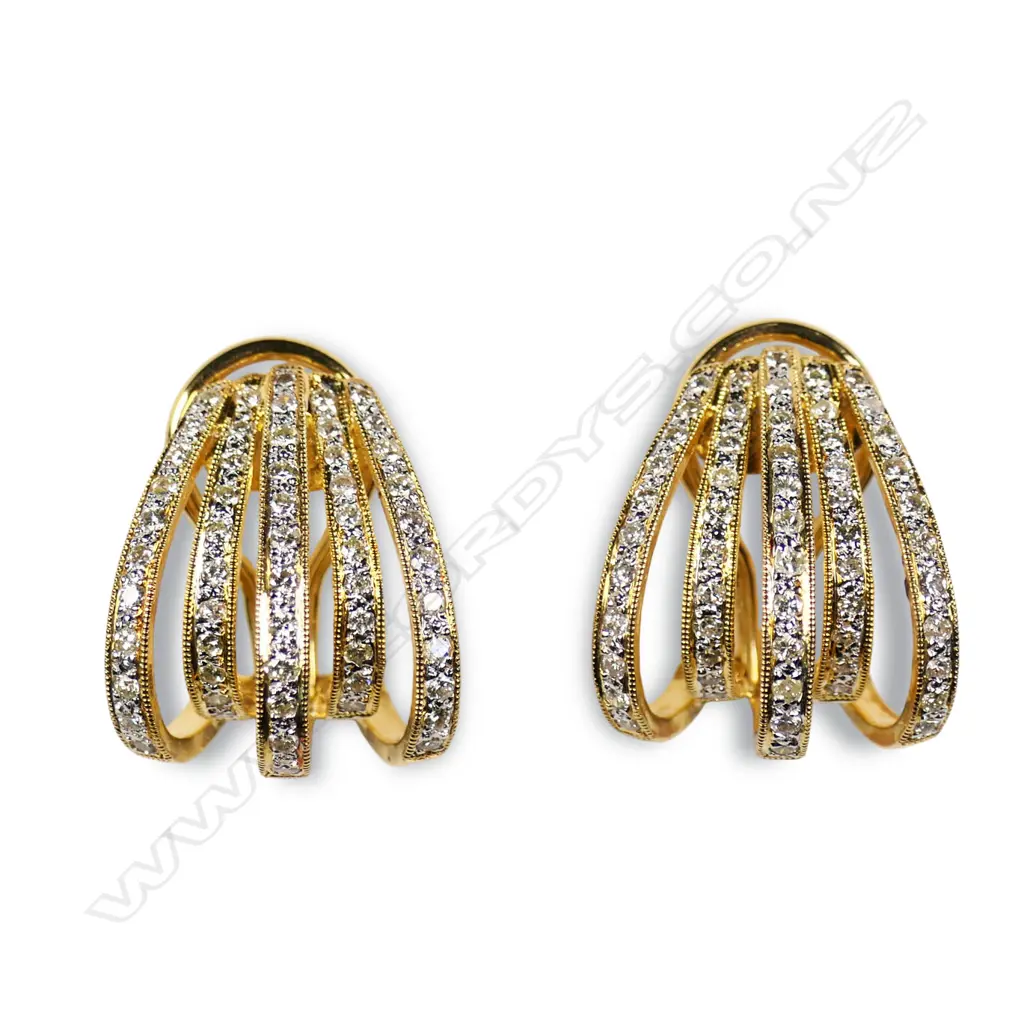 A pair of 18ct gold and diamond earrings, Image 1++