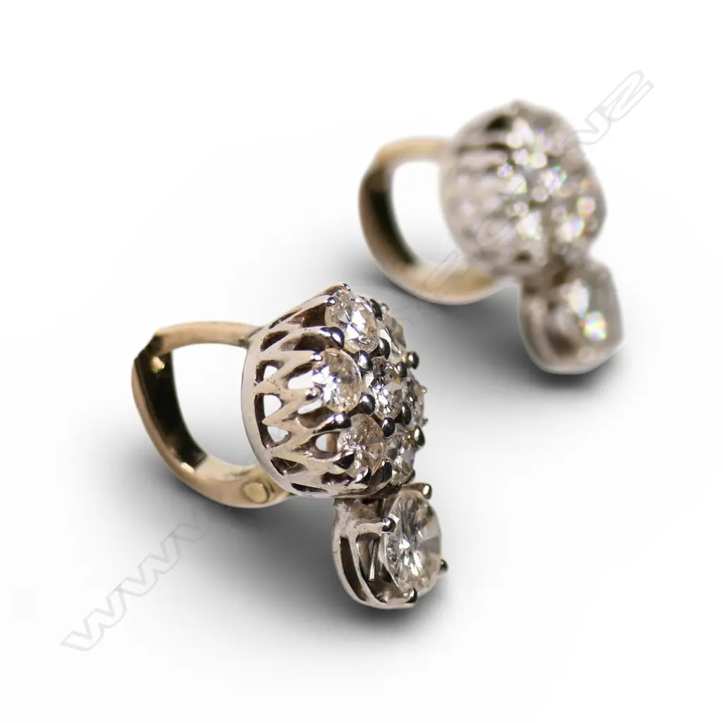 A pair of estate 14ct white gold and diamond earrings, Image 1++