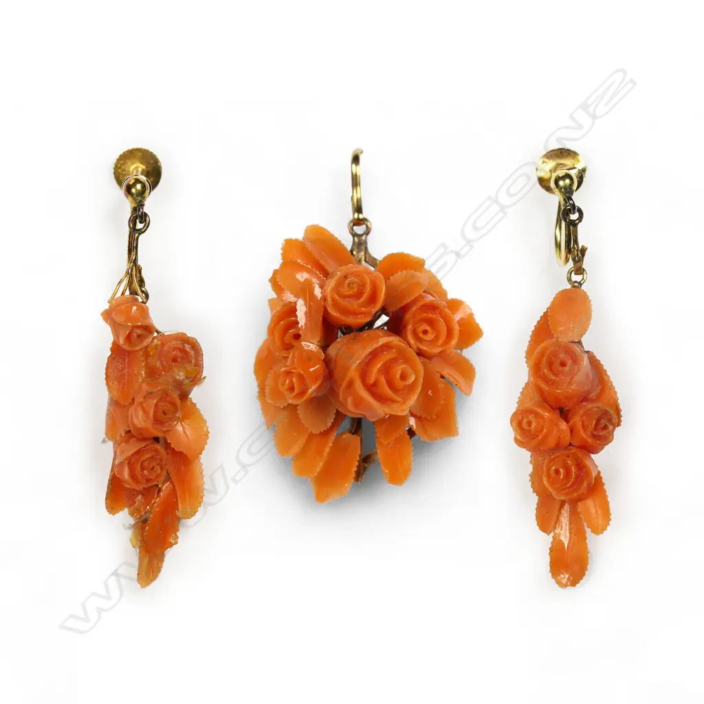 A 19thC 9ct gold and carved coral brooch and earring boxed set, Image 1++